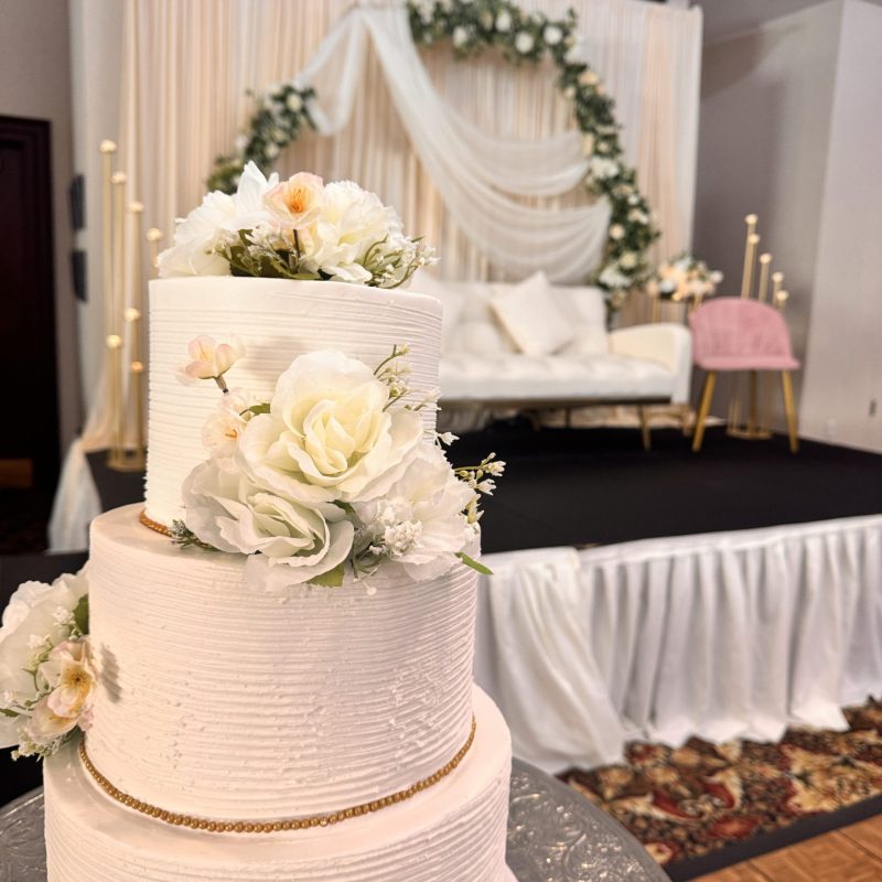 Consider The Wellington when searching for a Fishers Wedding Facility Near Me image shows cake in front of stage